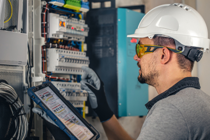 man-electrical-technician-working-switchboard-with-fuses.jpg